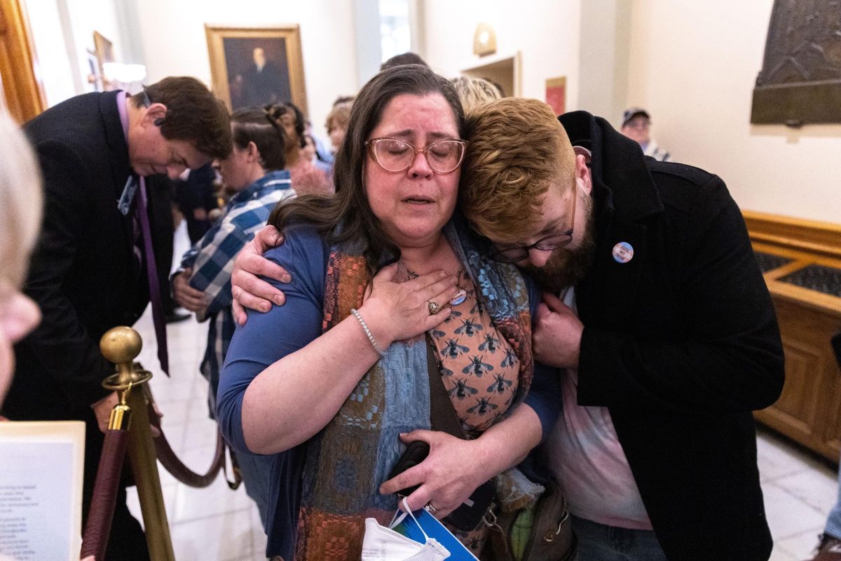 Christine Cox, center, a parent of a transgender teenager, becomes emotional after speaking to Georgia State Sen. Carden Summers, a Cordele Republican, back left, outside the Senate at the Capitol in Atlanta on Monday. Activists appeared at the Capitol to protest against Senate Bill 140, a bill sponsored by Summers that would prevent medical professionals from giving transgender children certain hormones or surgical treatment. The Senate approved the bill Tuesday, March 21, 2023, sending it to Gov. Brian Kemp for his signature. (Arvin Temkar/The Atlanta Journal-Constitution/TNS) ©2023 The Atlanta Journal-Constitution. Visit at ajc.com. Distributed by Tribune Content Agency, LLC.