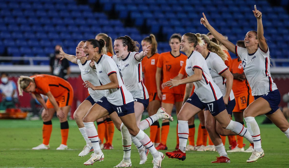 USA teammates rush to congratulate Megan Rapino and Team goalkeeper Alyssa Naeher (1) after a shootout victory over Netherlands in the Tokyo 2020 Olympics Womens Football Quarterfinal at International Stadium Yokohama in Yokohama, Japan, Friday, July 30, 2021. (Robert Gauthier/Los Angeles Times/TNS) ©2021 Los Angeles Times. Visit at latimes.com. Distributed by Tribune Content Agency, LLC.