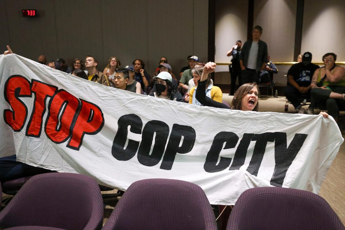 Protestors hold a banner and shout, Stop Cop City, during the public comment portion of the Atlanta City Council ahead of the final vote to approve legislation to fund the training center at Atlanta City Hall, on Monday, June 5, 2023, in Atlanta. (Jason Getz/The Atlanta Journal-Constitution/TNS) ©2023 The Atlanta Journal-Constitution. Visit at ajc.com. Distributed by Tribune Content Agency, LLC.