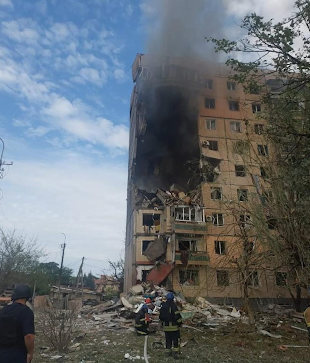 Residents view damage from a Russian missile attack on the city of Kryvyi Rih, Ukraine, on July 31, 2023. (Cover Images via Zuma Press/TNS) 