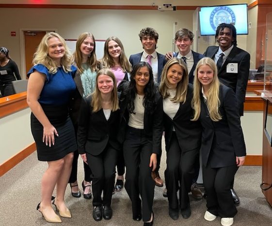 Mock Trial seniors celebrate a third consecutive regional win. Courtesy of Erin Chance.