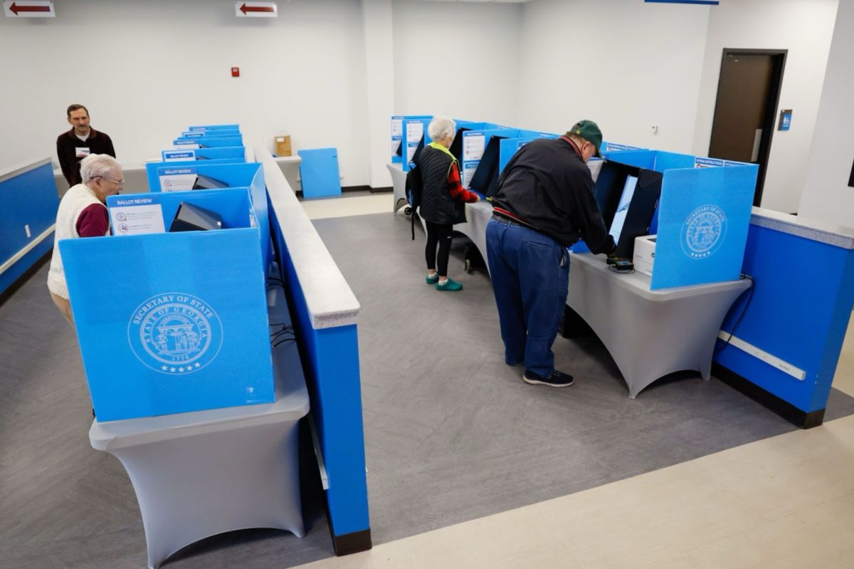 Gerogia voters cast ballots in recent primary. New laws may affect the counting of these votes.
Photo by Miguel Martinez/ AJC