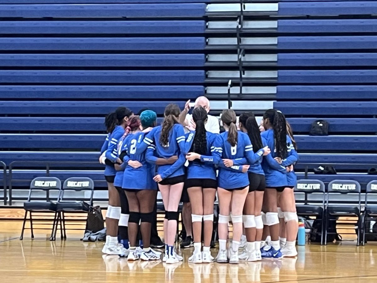 Paideia Girls Varsity Volleyball gathers for a timeout before defeating Decatur High on Aug. 21.