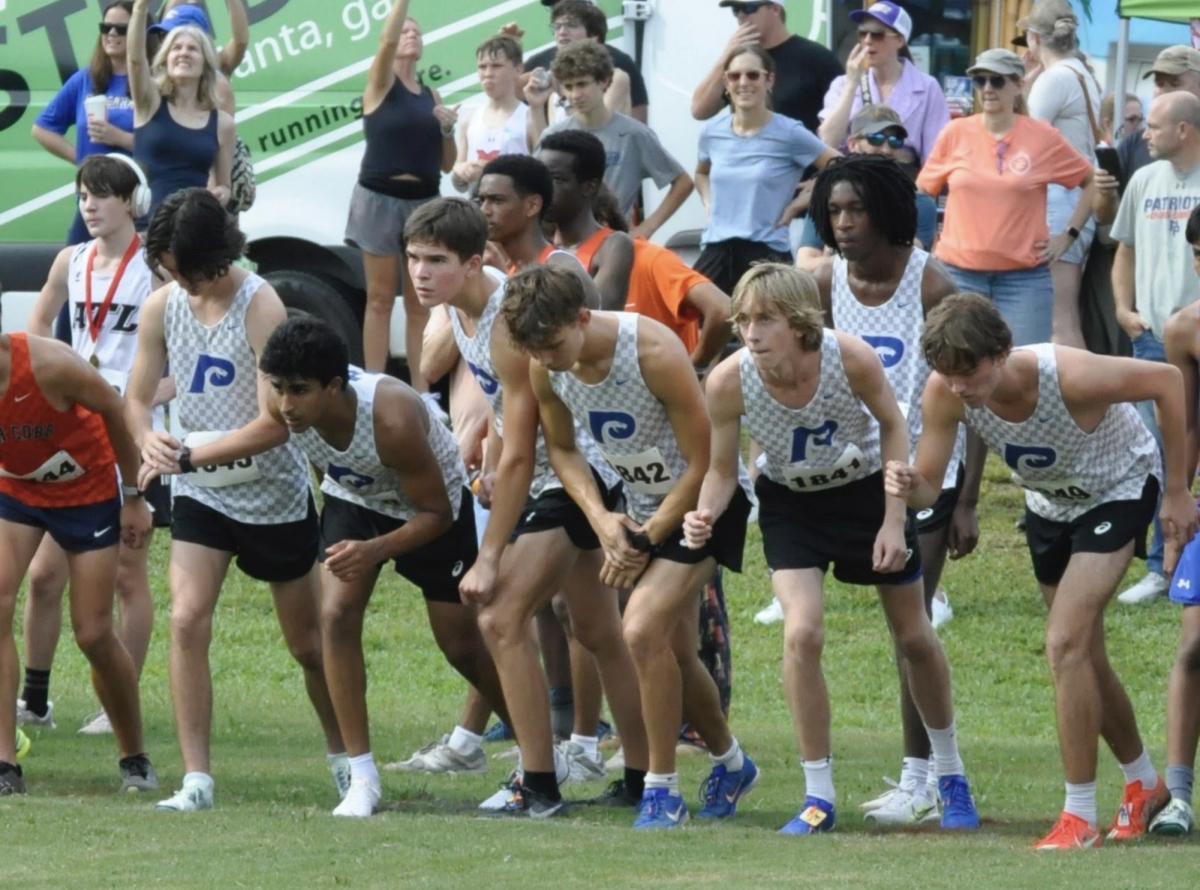Cross country runners line up to race Milton High School.