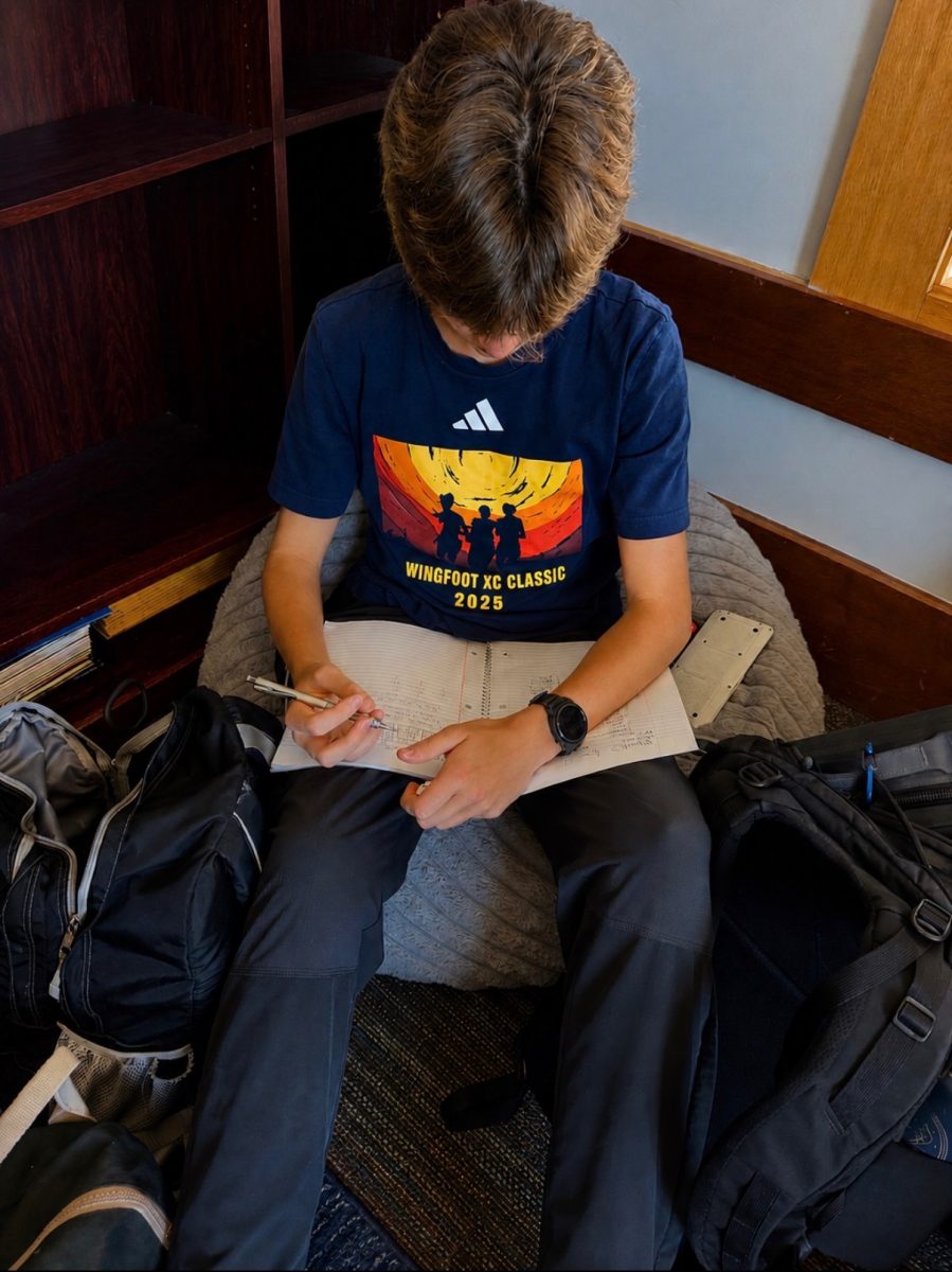 Miles Ong '29 wears his Wingfoot XC Classic T-shirt from last year's meet. 
